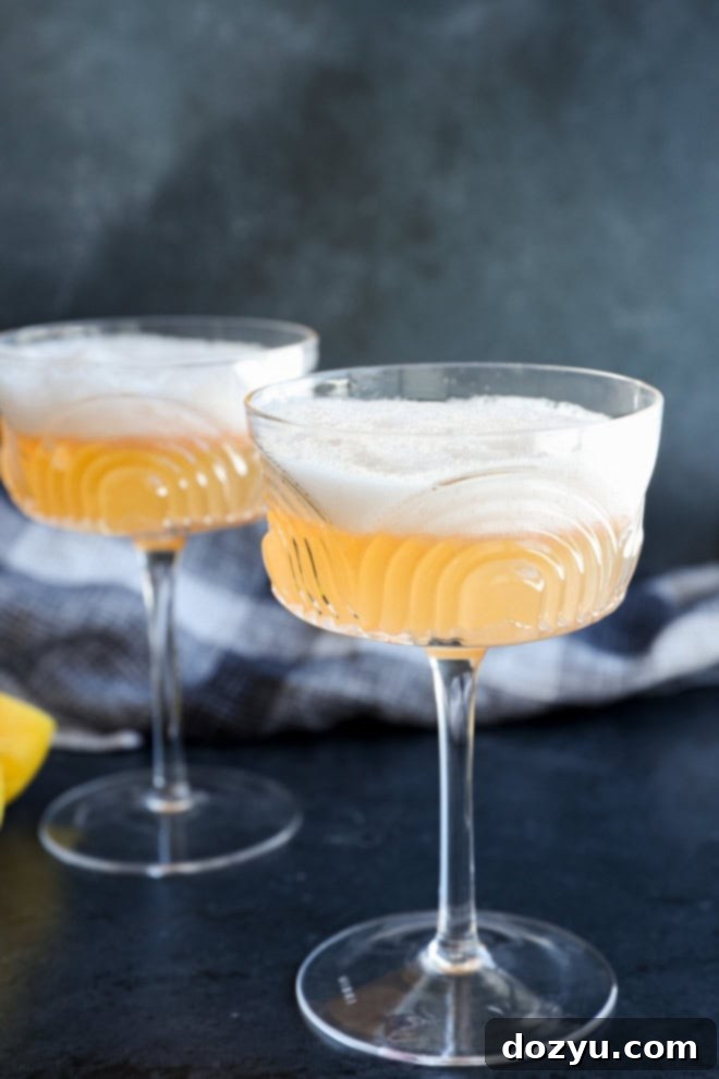 Classic Gin Sour Cocktail 4 Easy cocktail with luxurious egg white foam on top, served on linen