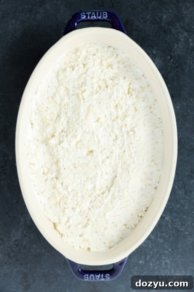 Warm Goat Cheese Dip 4 baked goat cheese appetizer in baking dish before baking