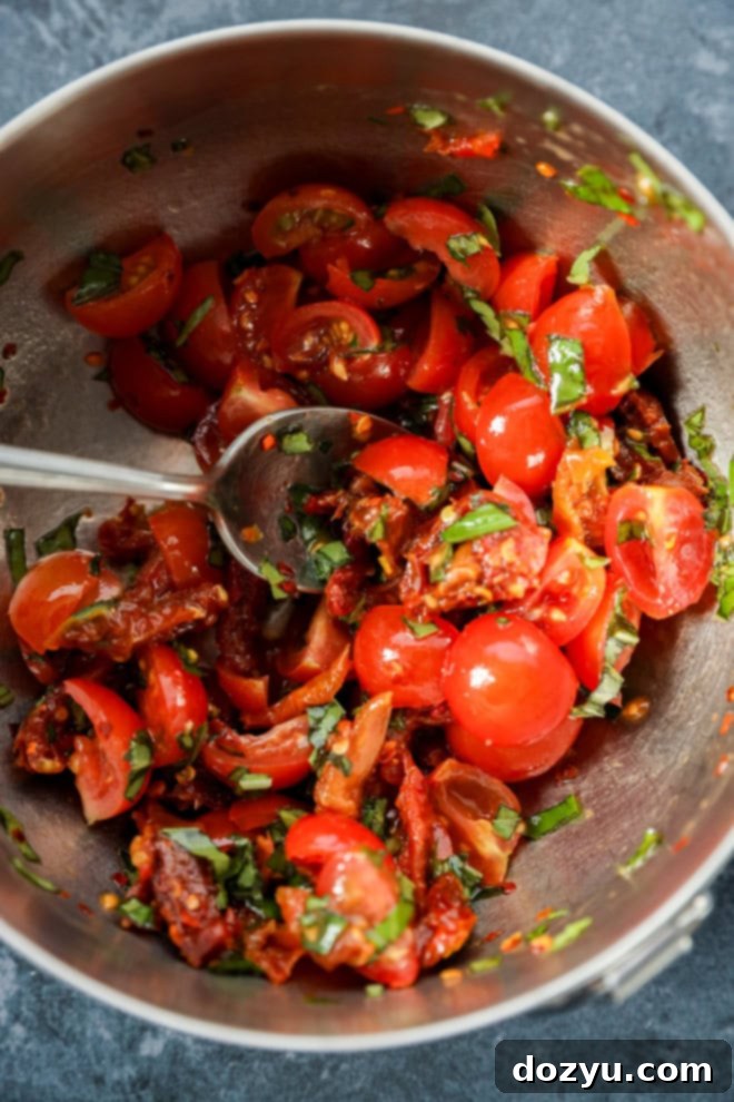 Warm Goat Cheese Dip 5 sun-dried tomato and cherry tomato mixture in a bowl