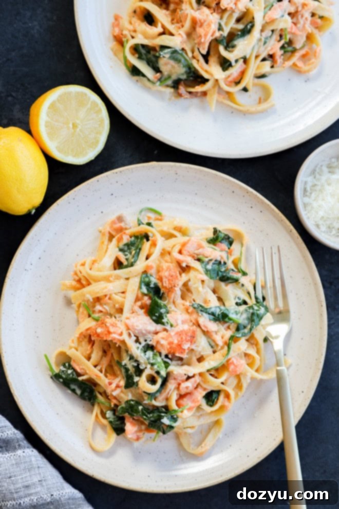 Bright Lemon Cream Salmon Pasta 2 easy weeknight creamy fettuccine recipe on plates with lemons