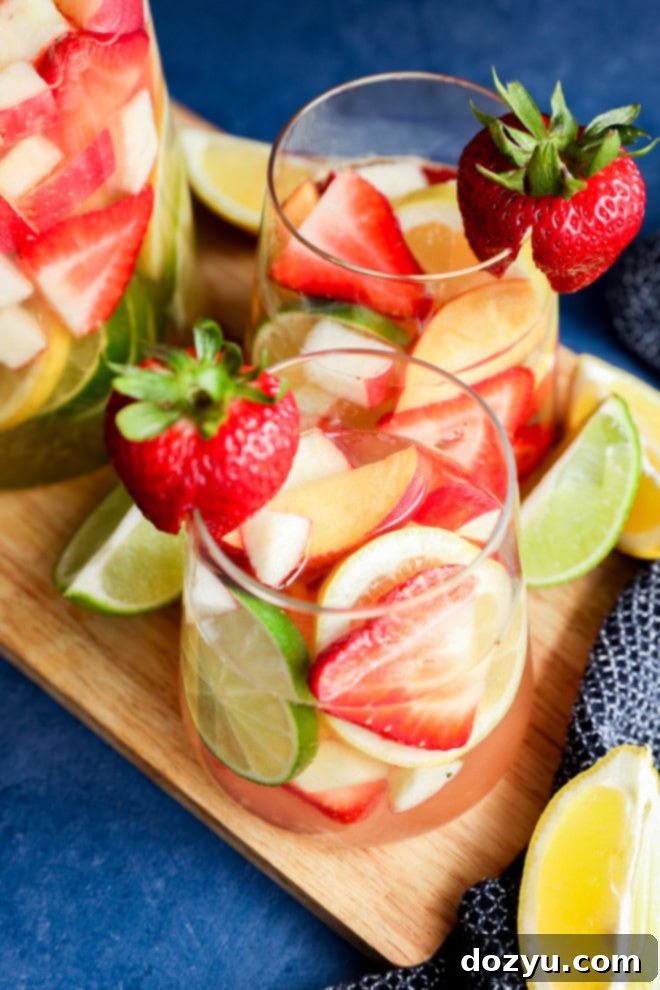 Crisp White Sangria Delight 2 easy White wine sangria with fresh fruit and citrus wedges on the side