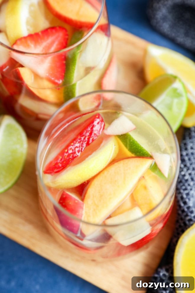 Crisp White Sangria Delight 7 glasses of White sangria with fresh citrus slices on the side