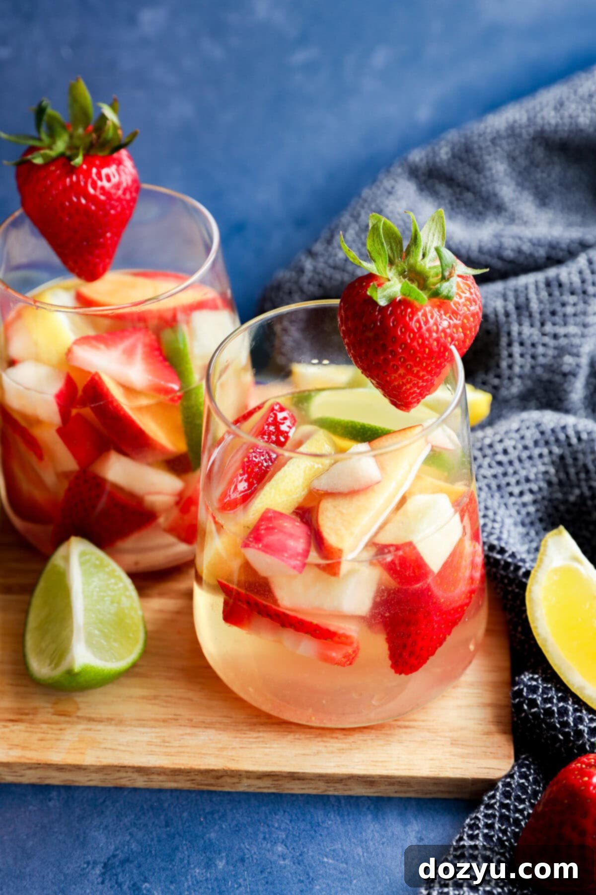 Crisp White Sangria Delight 9 White sangria with white wine, fresh fruit and citrus on wood