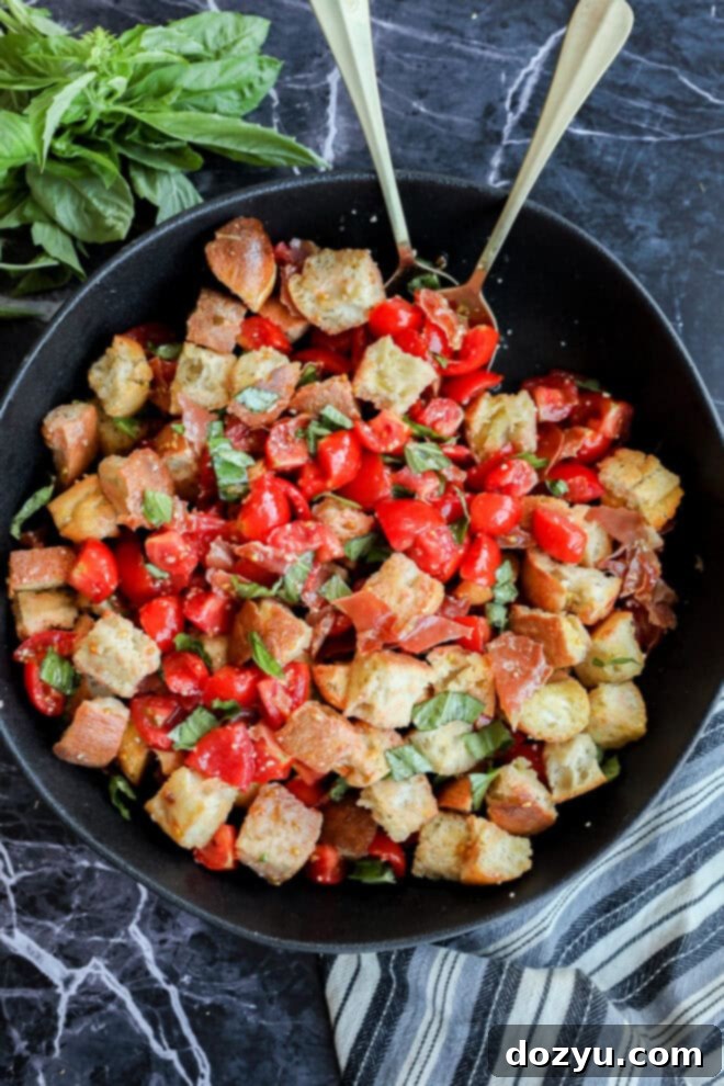 Tuscan Summer Bread Salad 2 Panzanella Toscana in large black serving bowl with striped linen and fresh basil