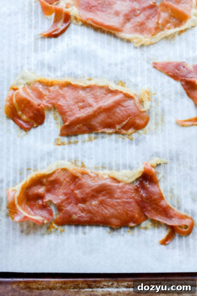Tuscan Summer Bread Salad 8 baked crispy prosciutto on baking sheet with parchment paper