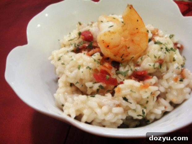 Kitchen's Calling: Shrimp and Bacon Risotto 2 Shrimp and Bacon Risotto in a white bowl with a rustic background.