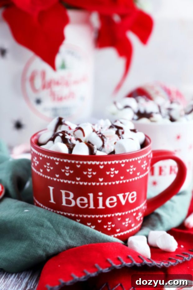 A steaming mug of slow cooker hot chocolate, topped with whipped cream and chocolate shavings, perfect for winter warmth.