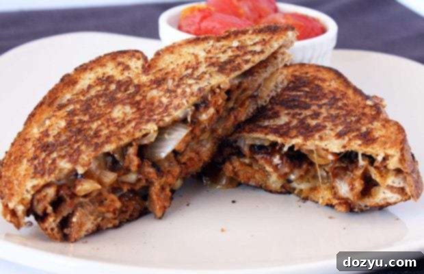 Fiery Stacked Cheese Melt with Bursting Tomatoes 2 Spicy Double Decker Grilled Cheese with Roasted Tomatoes recipe image, a delicious and gourmet take on comfort food.