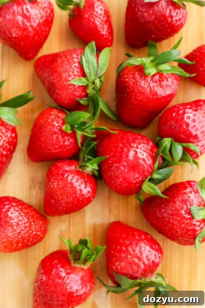 overhead photo of strawberries on cutting board
