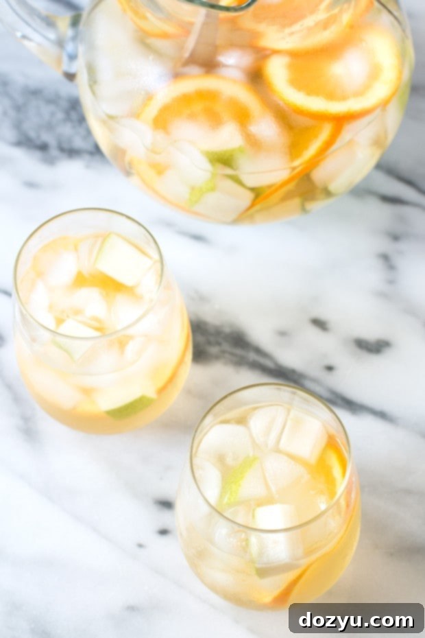 Sangria with pears and oranges in wine glasses