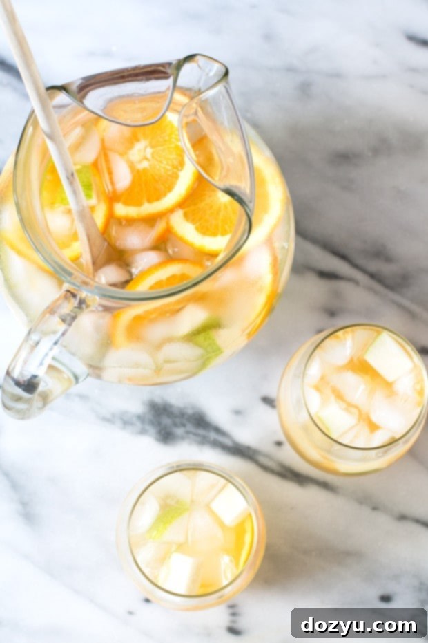 Summer white sangria with oranges and pears