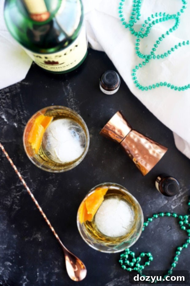 The Jameson Old Fashioned 3 Jameson old fashioned cocktail recipe picture, close-up of the drink with a focus on the liquid and ice