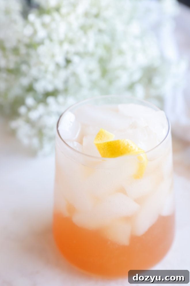 Close-up of a gin sling cocktail in a stemmed glass