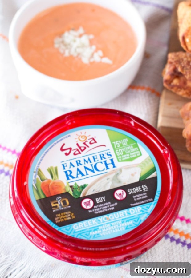 Close-up of golden brown Cheesy Bacon Ranch Chicken Egg Rolls