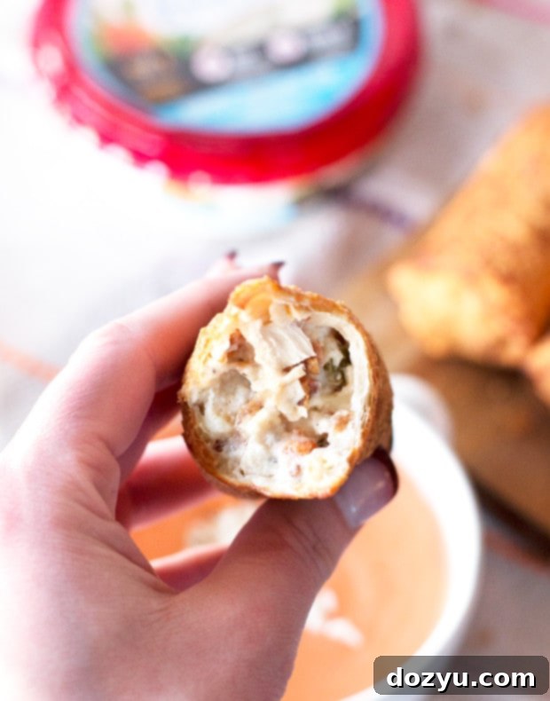 Assembled Cheesy Bacon Ranch Chicken Egg Rolls ready to be fried