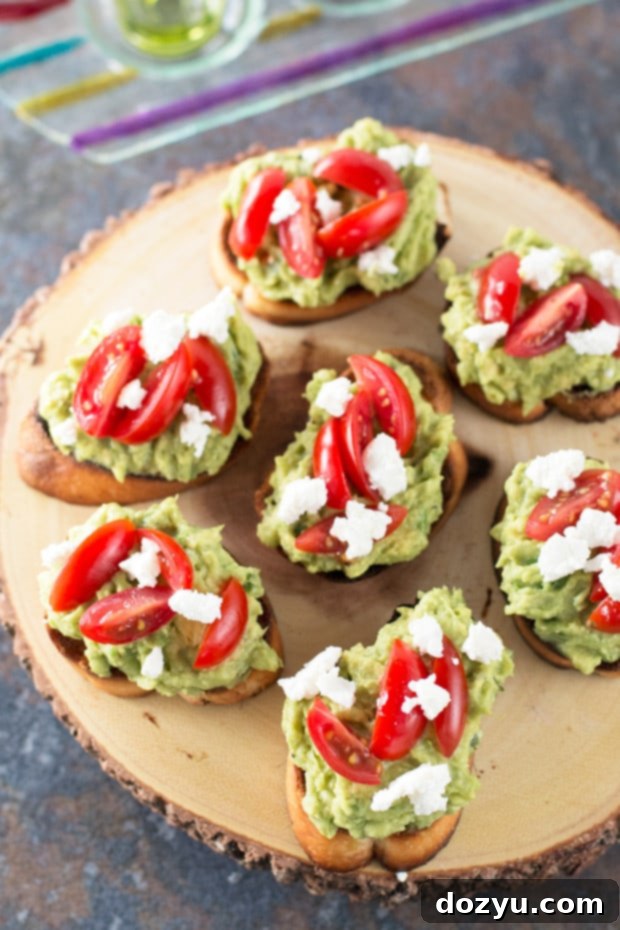 Fresh Avocado & Goat Cheese Crostini 3 Close-up of Avocado Goat Cheese Crostini on a platter