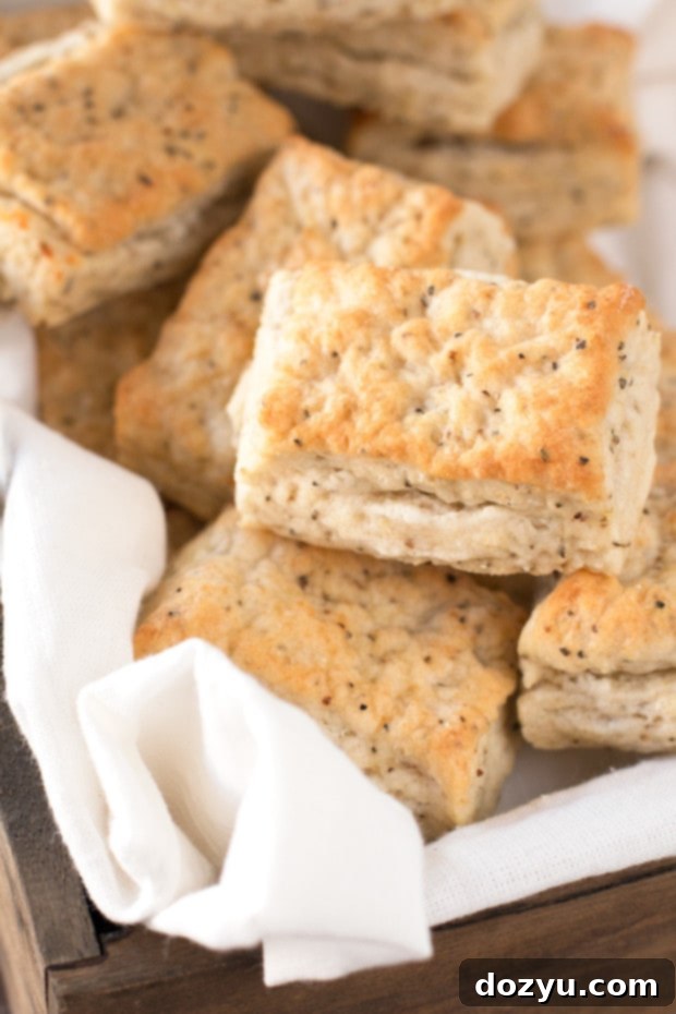 Zesty Black Pepper Goat Cheese Biscuits 2 Flaky Black Pepper Goat Cheese Biscuits ready to be served