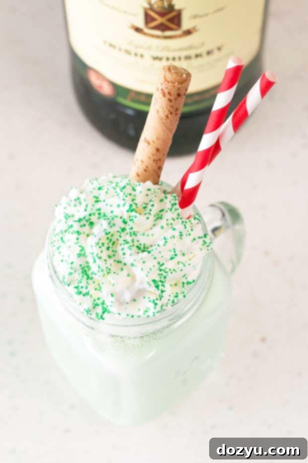 Close-up of a Boozy Green Shamrock Shake with a vibrant green hue