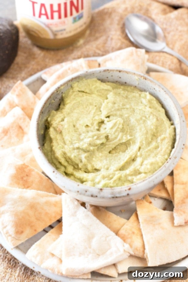Avocado Tahini Dip garnished with a sprinkle of paprika, ready to be served