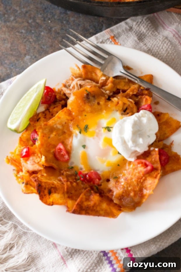 Delicious Chilaquiles with Fried Eggs and Fresh Toppings