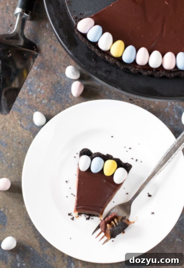 Slice of Chocolate Bourbon Caramel Tart showcasing its layers