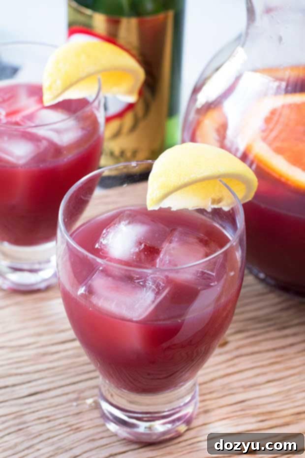 Sake Sangria pitcher with orange slices | cakenknife.com