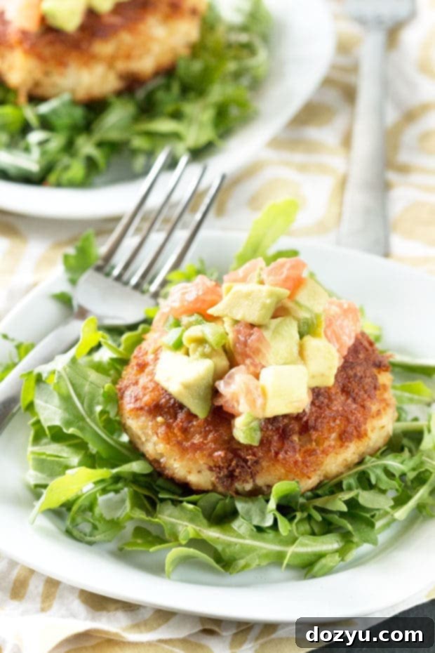 Homemade Crispy Crab Cakes served with a fresh, zesty Avocado Grapefruit Salsa, perfect for a summertime meal.