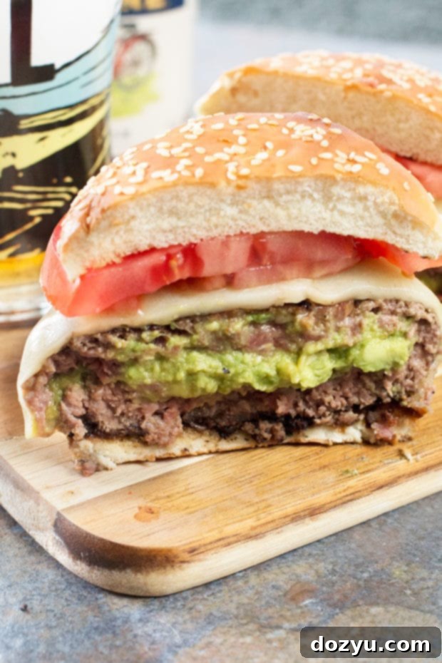 Close-up of a Bacon-Wrapped Guacamole Burger Bomb with melted cheese