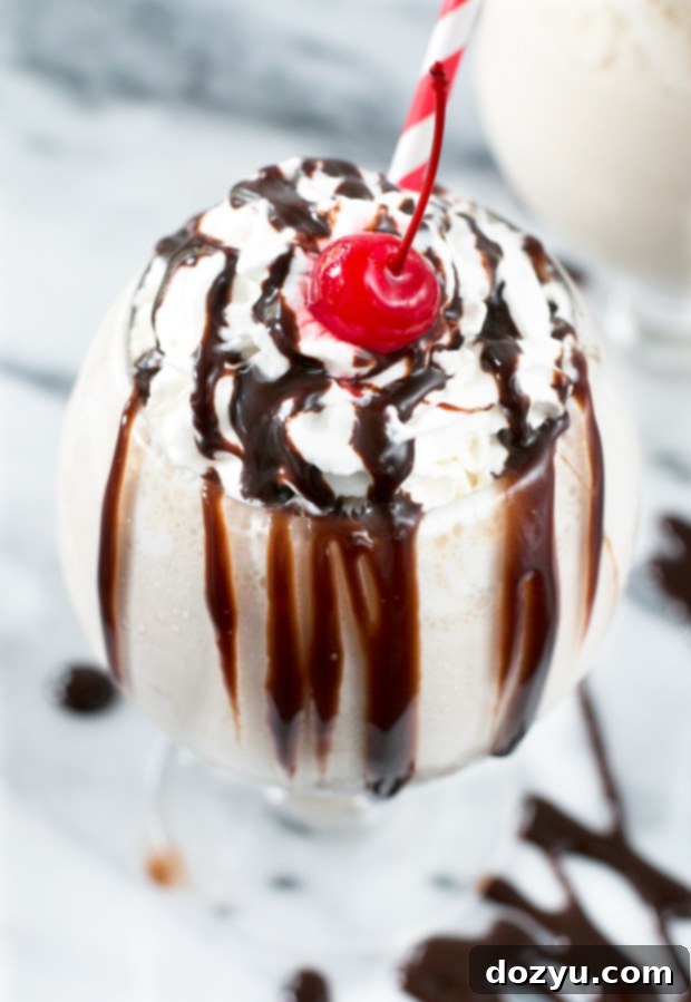 Decadent Kentucky Mudslide Shake 3 Rich and creamy Kentucky Mudslide Shake with whipped cream and chocolate drizzle