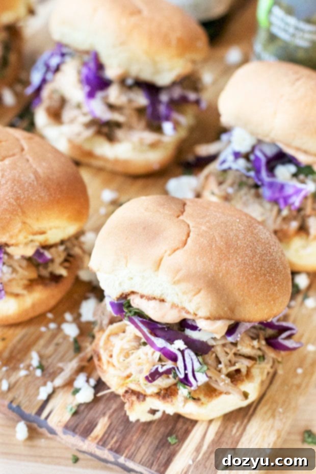 Delicious Cilantro Chili Lime Pulled Pork Sliders ready for serving at a party