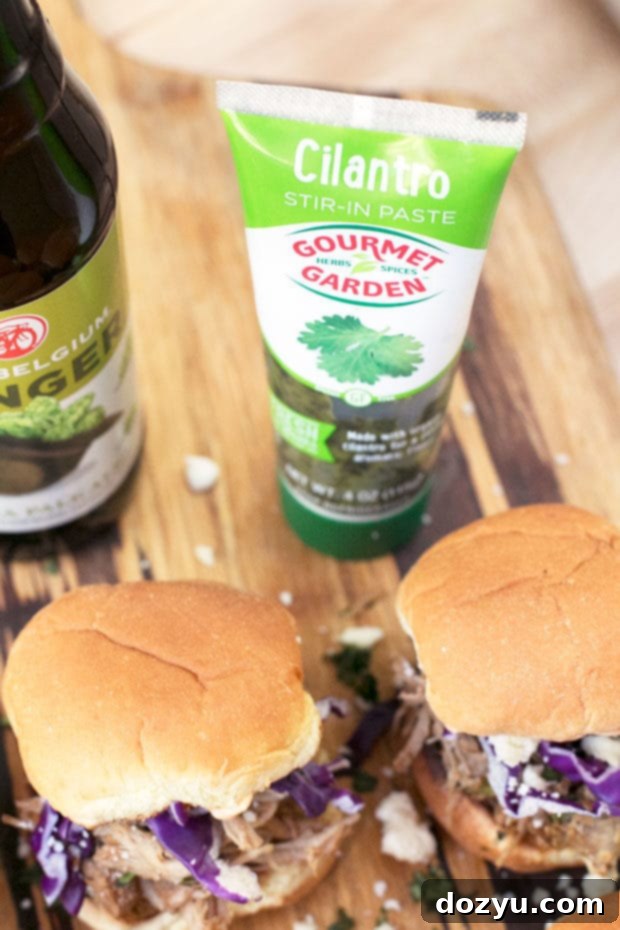 Preparing the fresh toppings for Cilantro Chili Lime Pulled Pork Sliders including shredded cabbage and cilantro