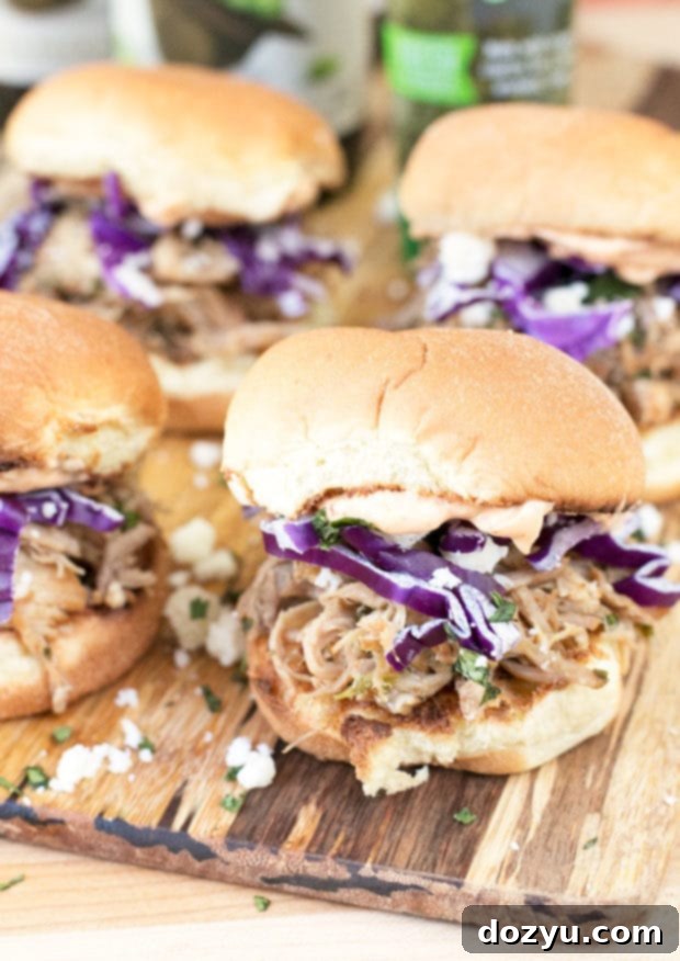 Platter of freshly assembled Cilantro Chili Lime Pulled Pork Sliders ready to be devoured