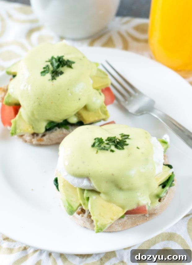 California-Style Eggs Benedict featuring creamy avocado hollandaise and perfectly poached eggs.