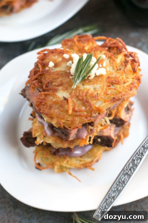 Assembled Garlic Rosemary Steak and Potato Stacks with Red Wine Blue Cheese Sauce Garnish