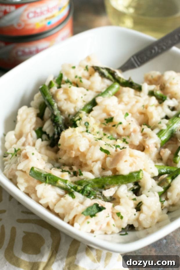Creamy Salmon Lemon Risotto with Asparagus, garnished with fresh parsley.