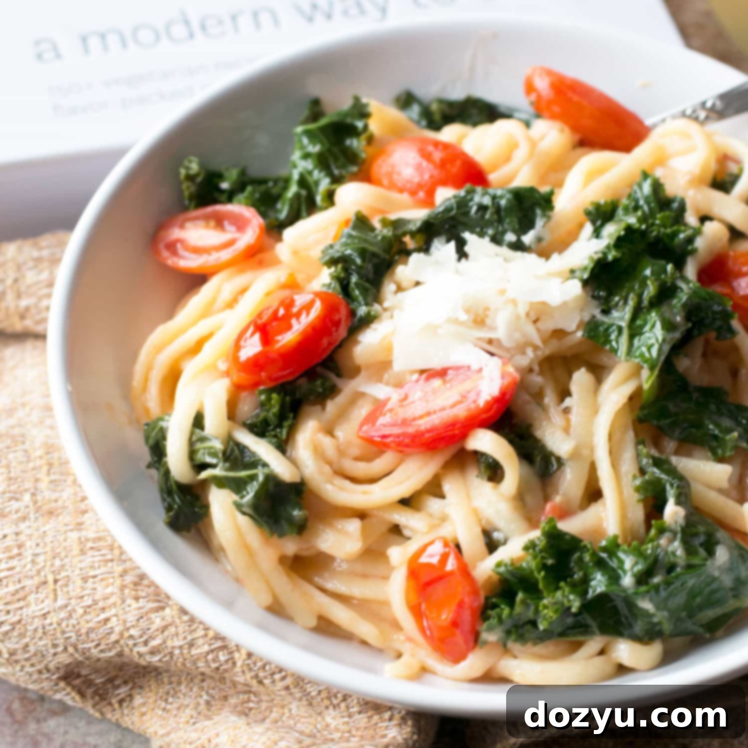 Exploring A Modern Way to Cook and its Kale Tomato Lemon Magic One Pot Spaghetti 6 Cooked One-Pot Kale, Tomato, and Lemon Spaghetti in a serving bowl