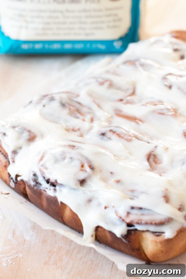 Close-up of freshly baked Egg Nog Cinnamon Rolls in a pan