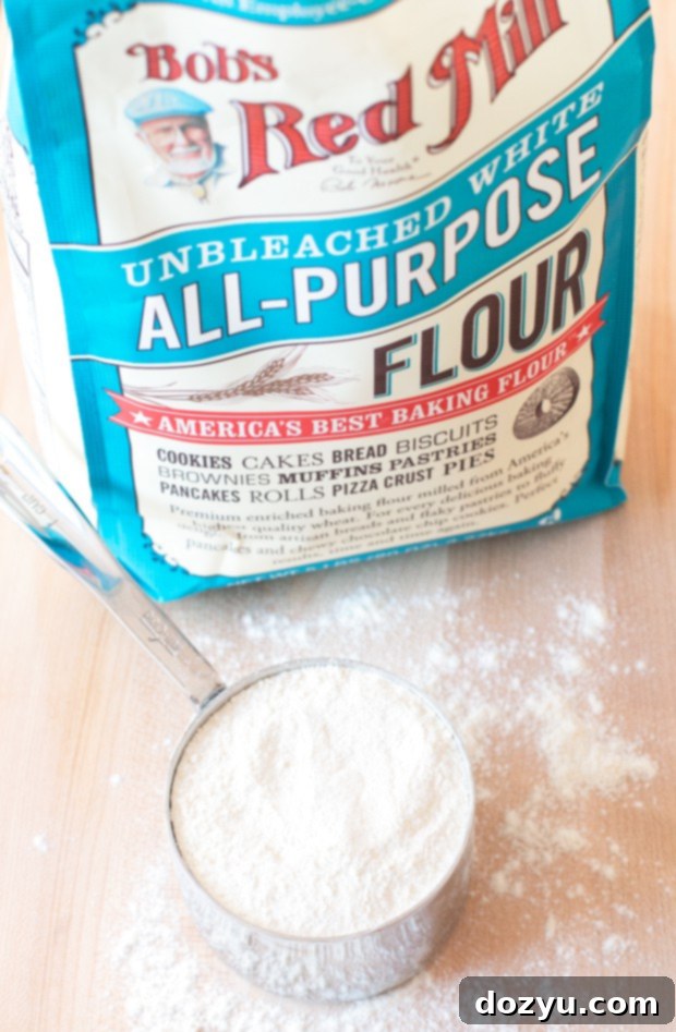 Perfectly swirled Egg Nog Cinnamon Rolls, glistening with frosting