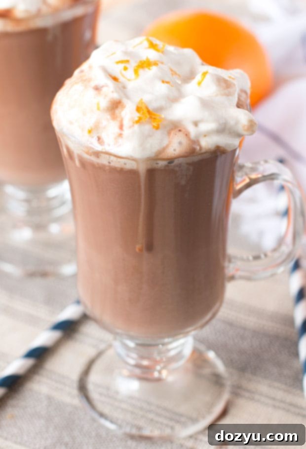 Rich Hot Orange Mocha Cocktail with Espresso Whipped Cream, perfect for cold winter nights by the fire
