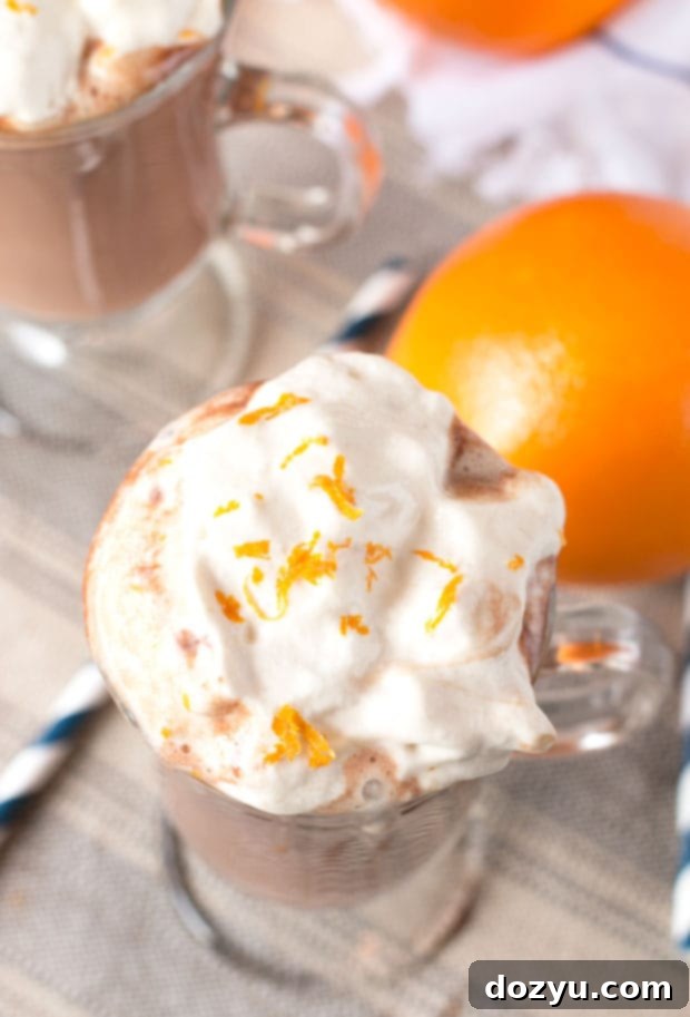 Ingredients for Hot Orange Mocha Cocktail laid out on a wooden surface, ready for preparation