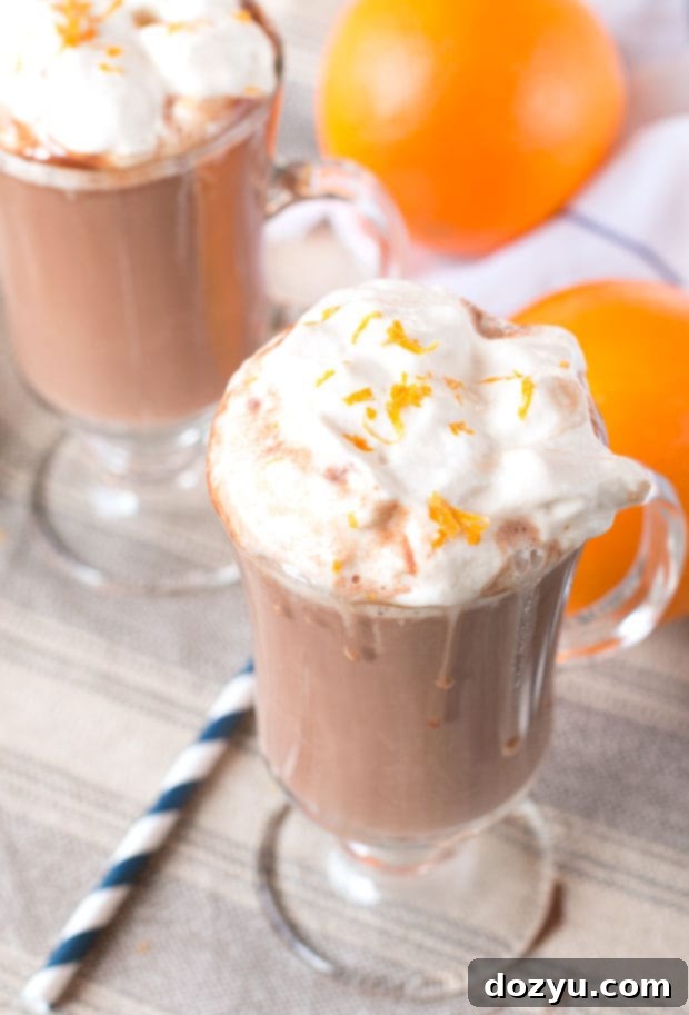Close-up of Hot Orange Mocha Cocktail in a mug, showcasing its creamy texture and garnish