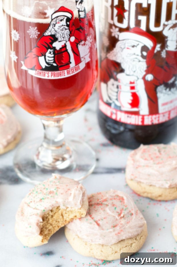 Ale-Kissed Christmas Sugar Cookies with Spiced Buttercream 6 Hand holding a Christmas Ale Sugar Cookie with Spiced Buttercream Frosting | cakenknife.com