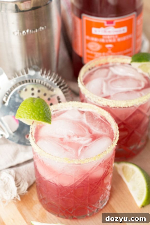 A frosty Winter Citrus Margarita in a stemmed glass, ready to be enjoyed, highlighting its invigorating appeal.