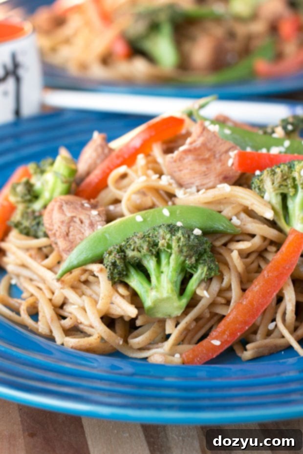Freshly cooked Stir Fry Pasta in a pan with chopsticks.