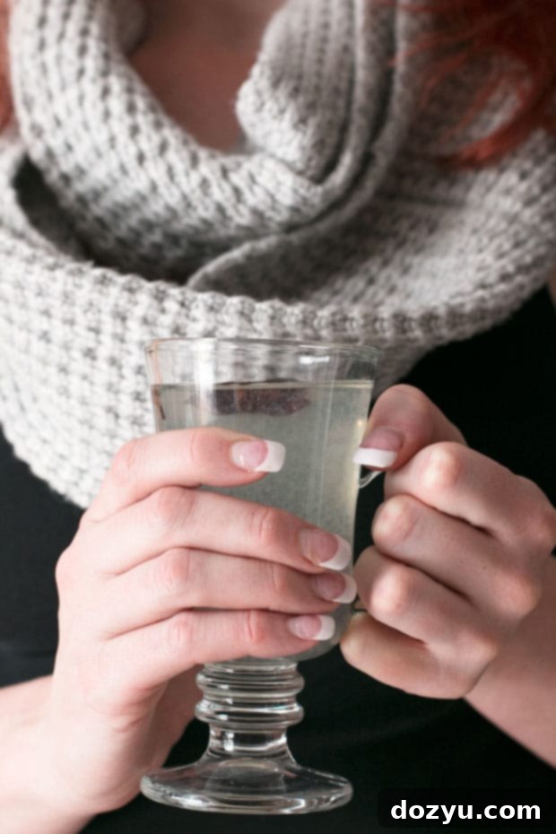 Toasted Hazelnut Rum Warmer 6 Ingredients for Hot Hazelnut Rum Cocktail, including a bottle of hazelnut rum, fresh limes, cloves, and star anise pods.