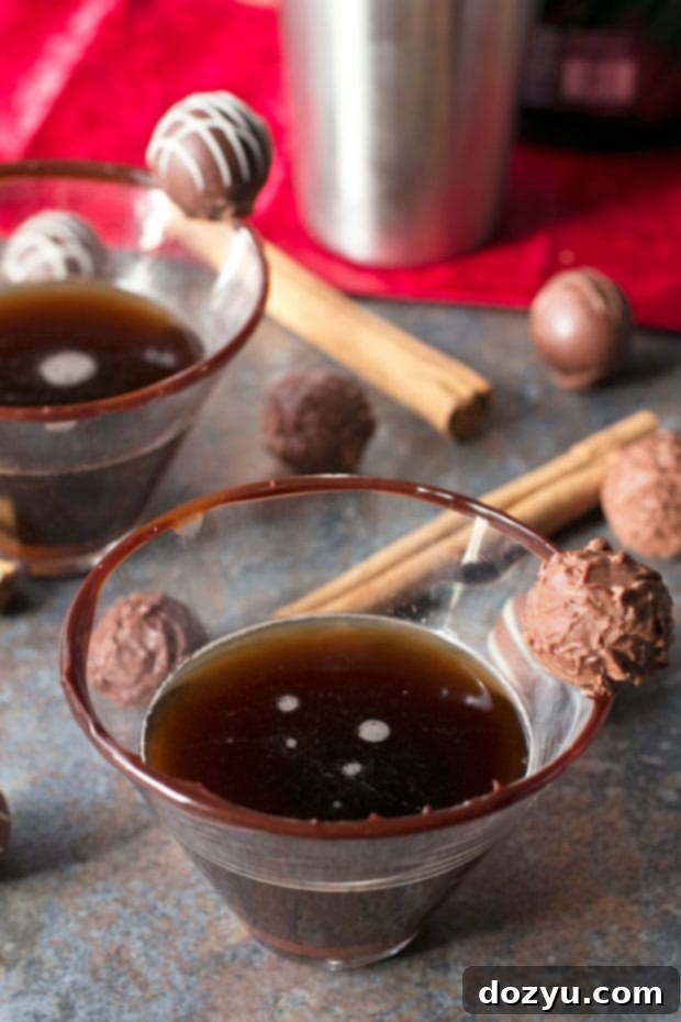 A close-up of a Spiced Truffle Martini with a hot fudge rim, ready to be enjoyed
