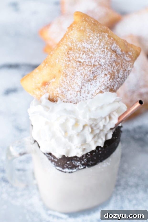 Creamy Beignet and Coffee Cocktail Shake with whipped cream and a beignet garnish