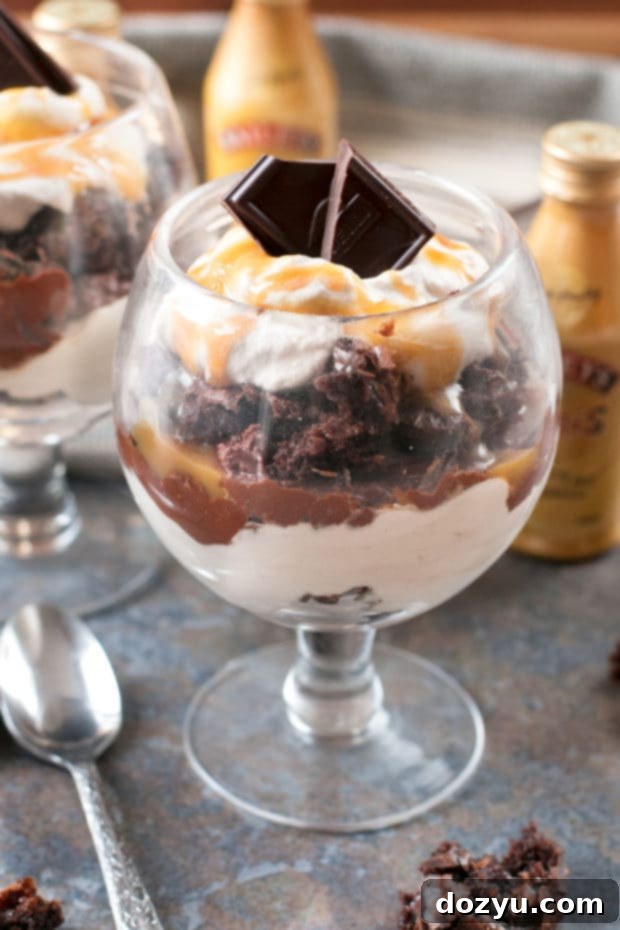 Close-up of a Bailey's Chocolate Mousse Brownie Parfait with layers of mousse, brownie, and whipped cream