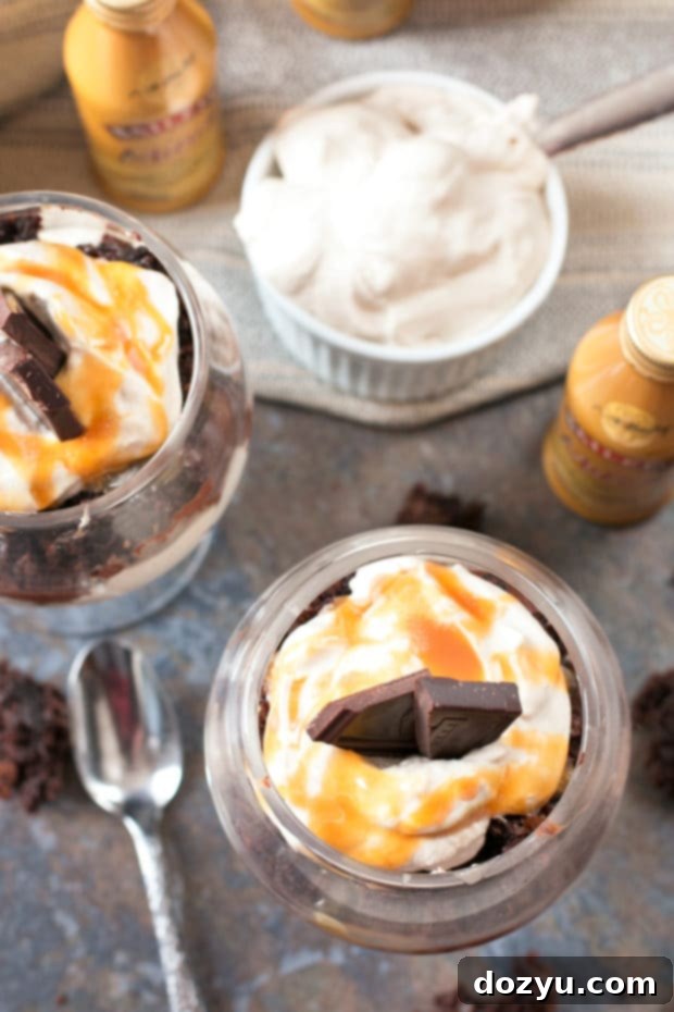 Three Bailey's Chocolate Mousse Brownie Parfaits ready to be served