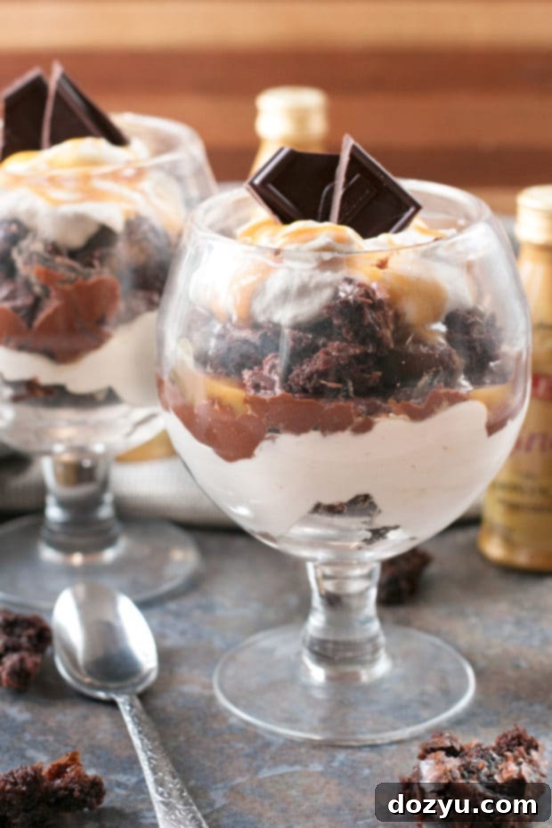 Overhead view of a Bailey's Chocolate Mousse Brownie Parfait with a spoon digging in